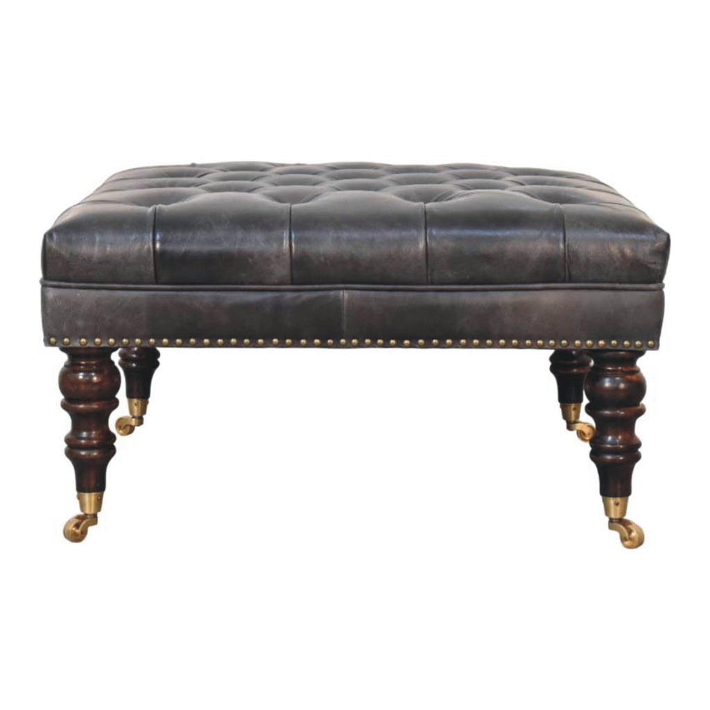 Pouf noir cuir tapissé