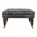 Pouf noir cuir tapissé