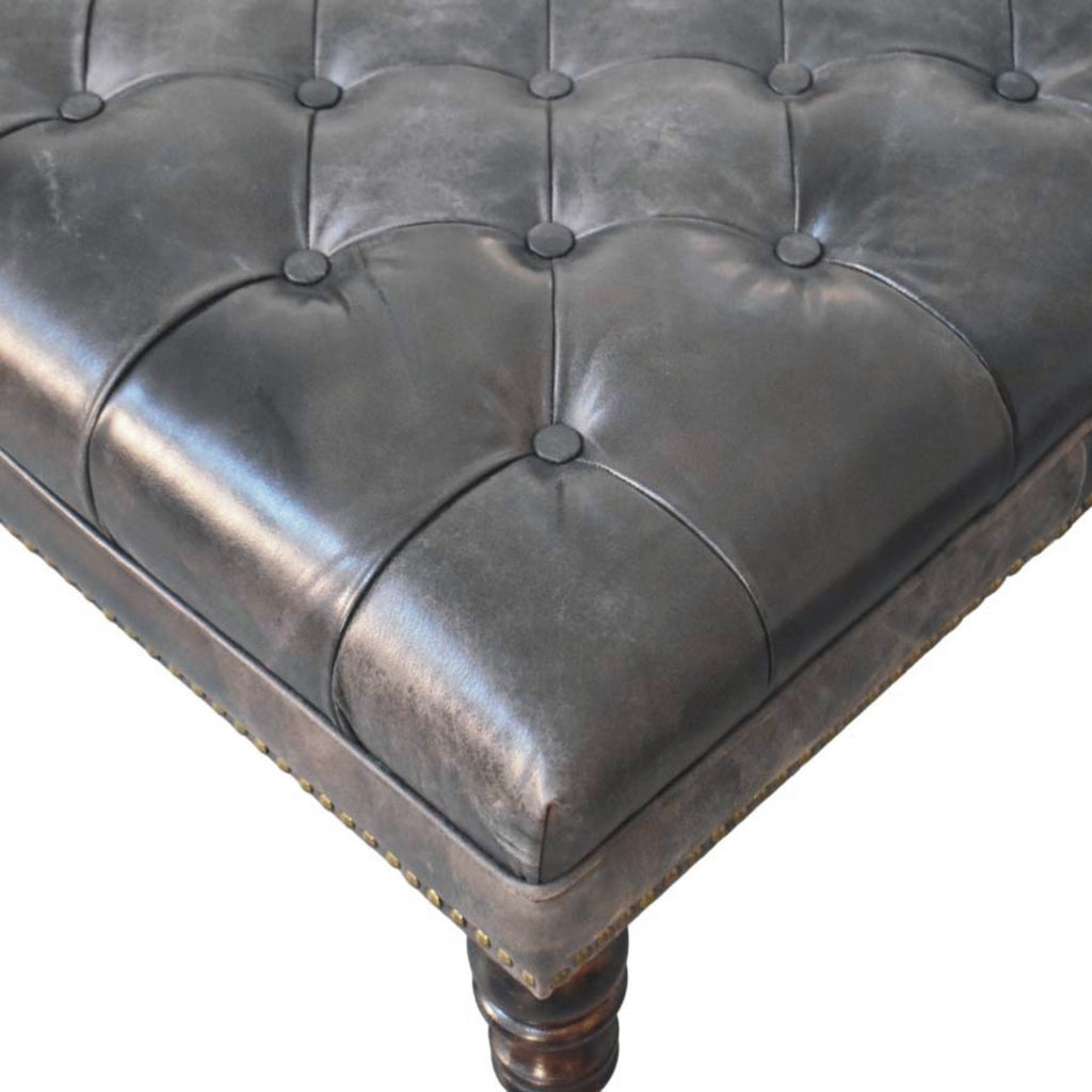 Pouf noir cuir tapissé