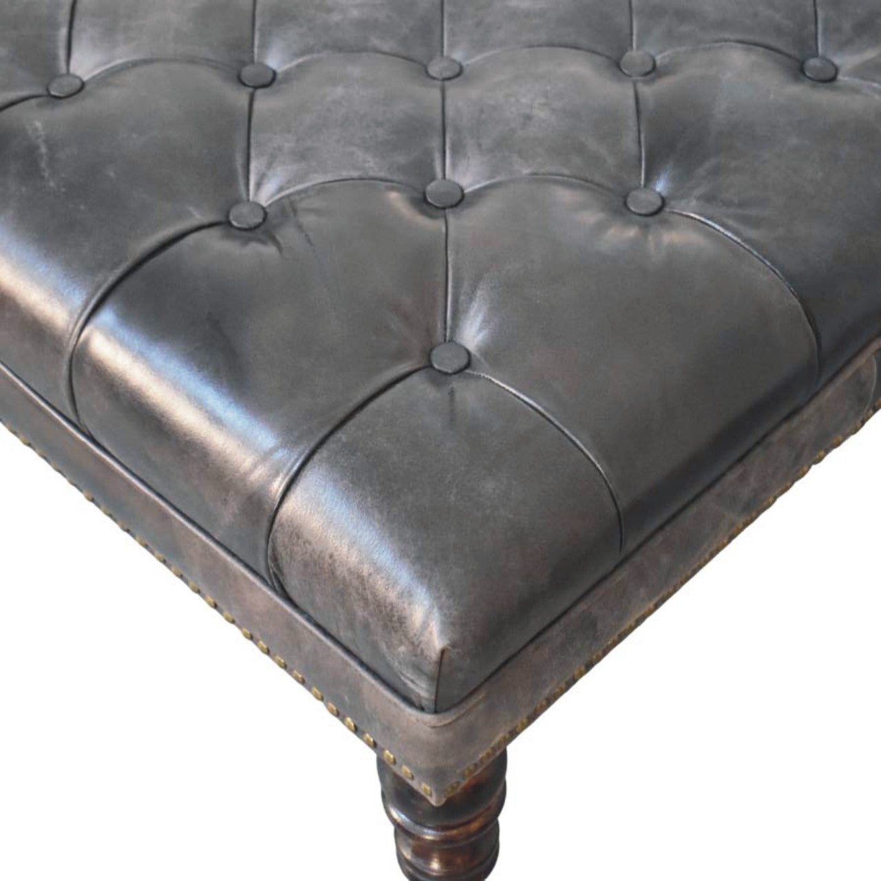 Pouf noir cuir tapissé