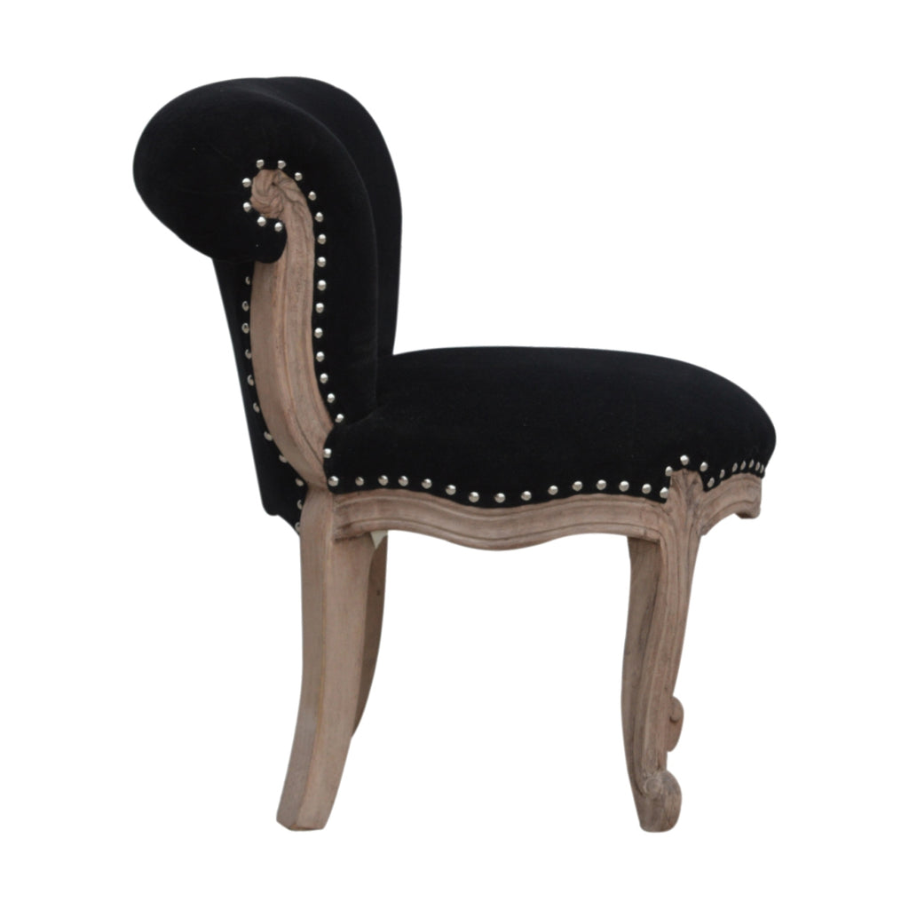 Chaise noir velours clouté